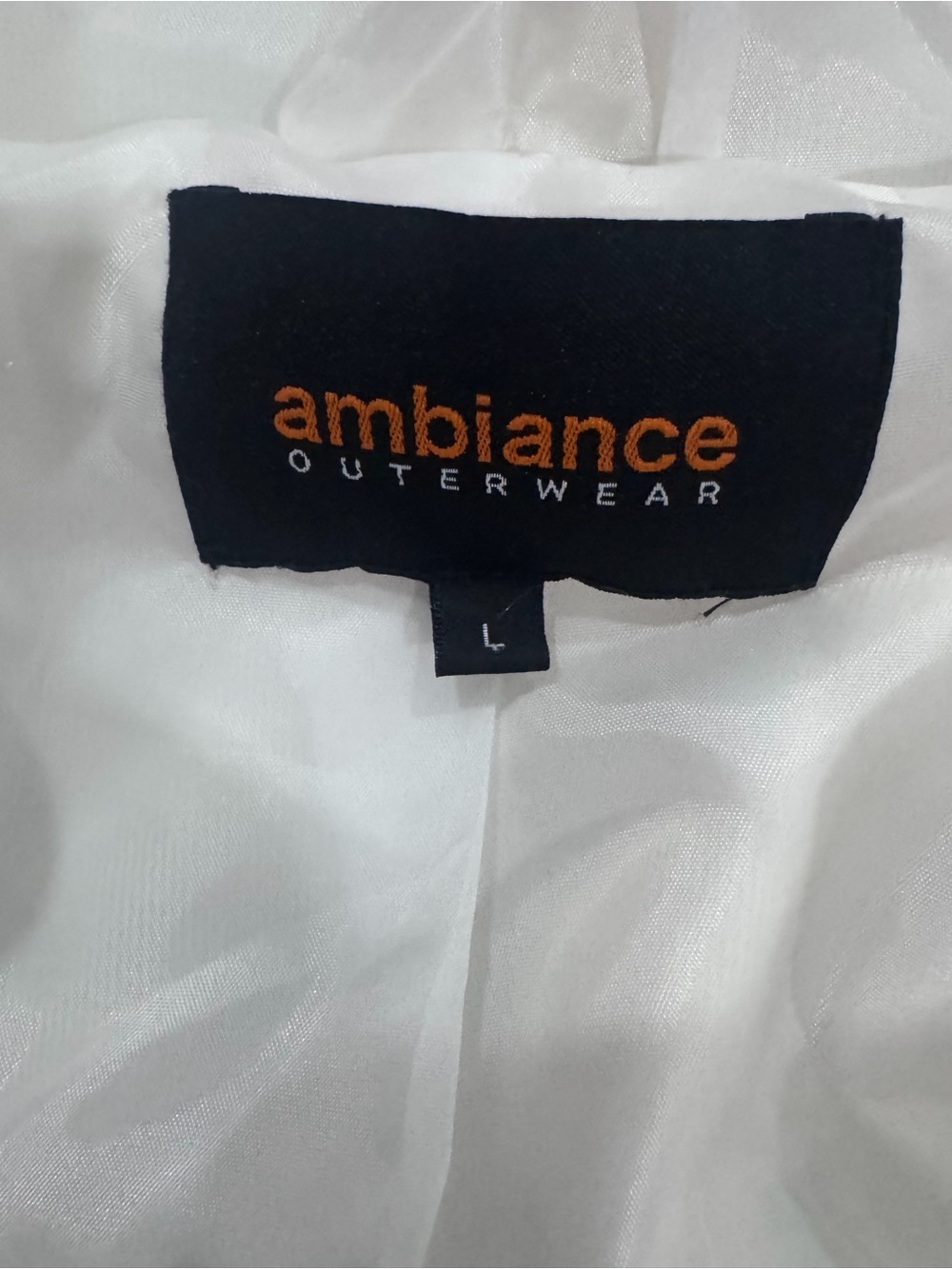 Ambiance White Teddy Jacket with Black Label and Orange Logo
